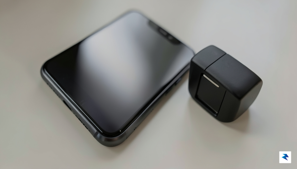 A close-up, high-resolution shot of a modern smartphone resting near…